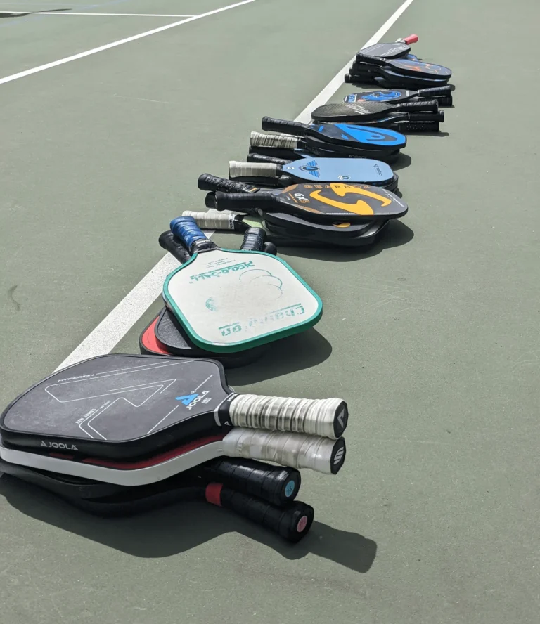 Sometimes when it gets very crowded, there are many paddle stacks on the side of the court.